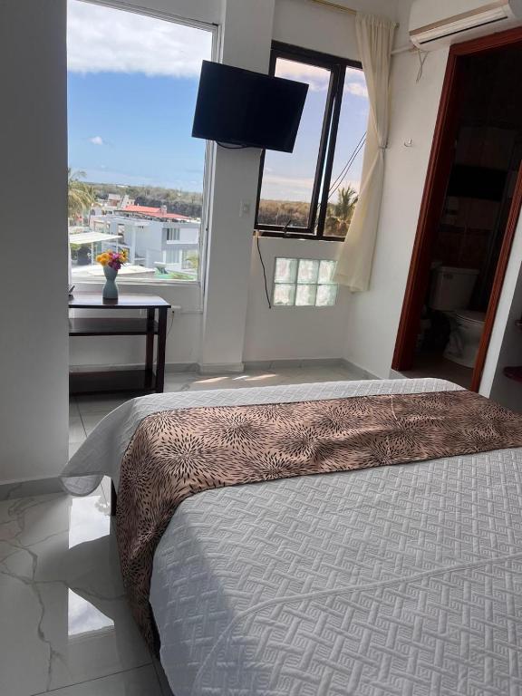 Postel nebo postele na pokoji v ubytování Hostal Carliza