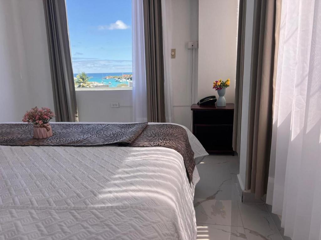 Postel nebo postele na pokoji v ubytování Hostal Carliza