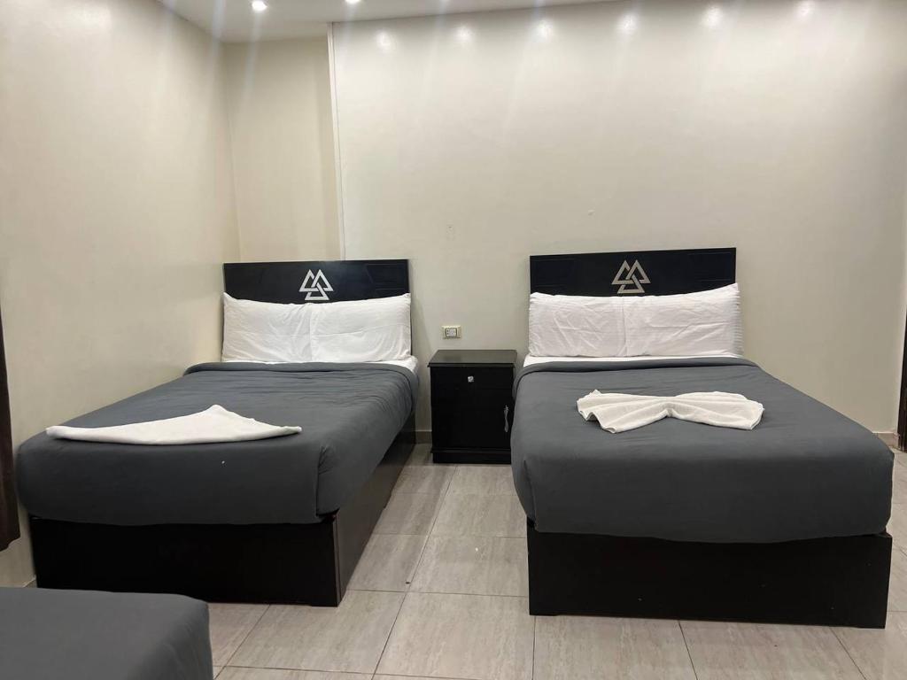 Postel nebo postele na pokoji v ubytování City pyramids inn