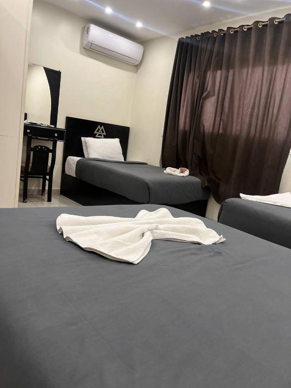 Postel nebo postele na pokoji v ubytování City pyramids inn