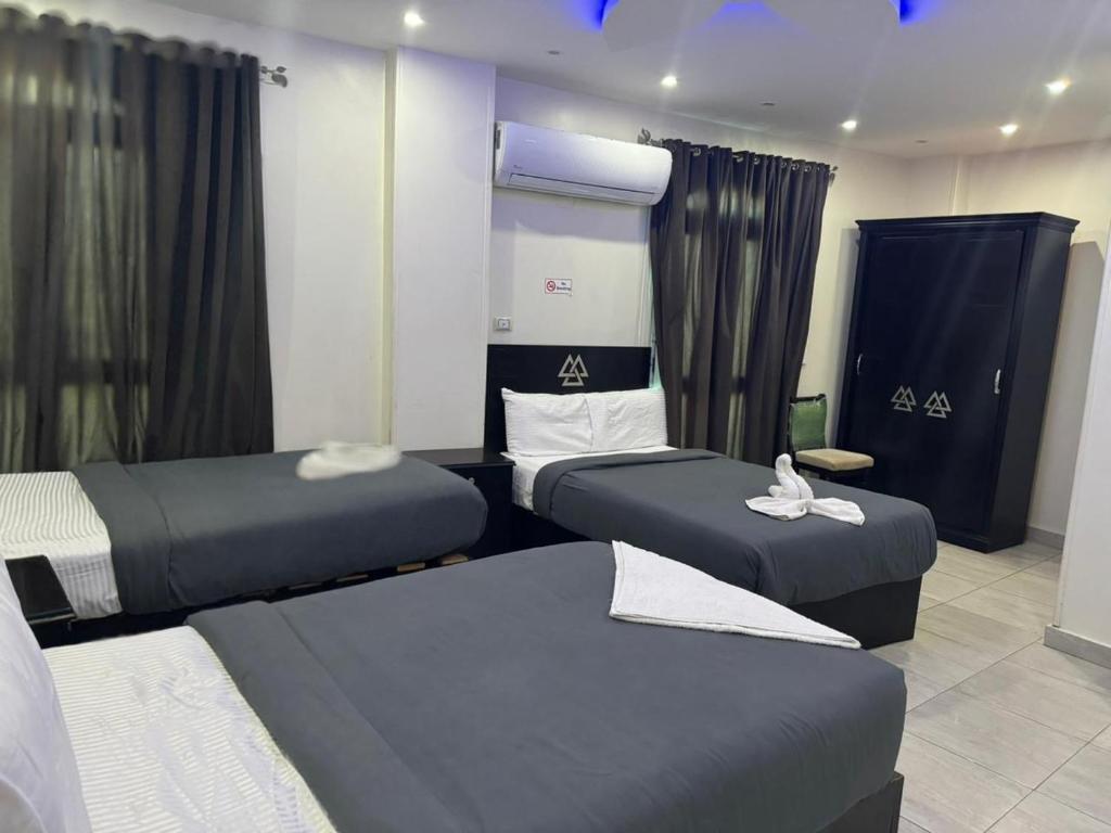 Postel nebo postele na pokoji v ubytování City pyramids inn