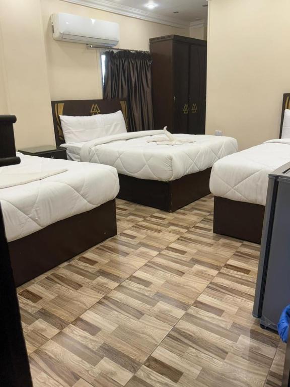 Postel nebo postele na pokoji v ubytování City pyramids inn