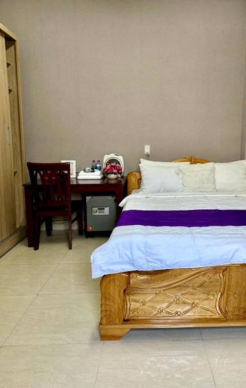 Postel nebo postele na pokoji v ubytování Nhà nghỉ Nghĩa Nhân
