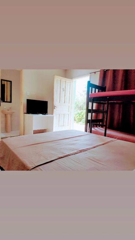 Cama ou camas em um quarto em Pousada 4 cantos