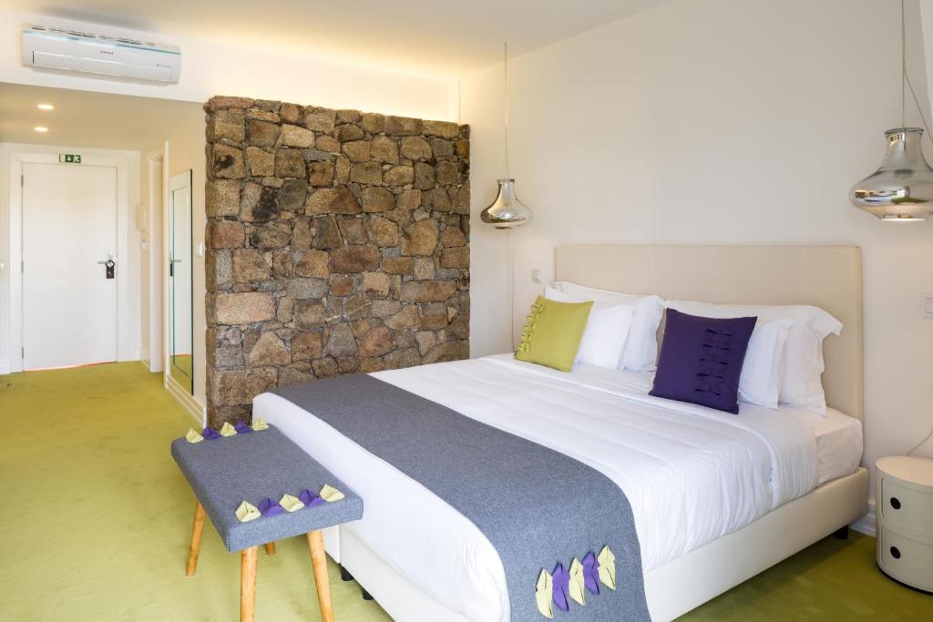 Uma cama ou camas num quarto em Cerca Design House