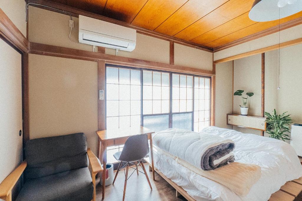 Postel nebo postele na pokoji v ubytování yururito guesthouse