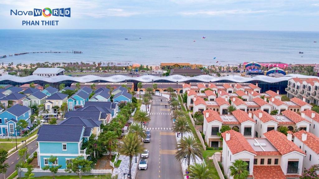 arial view of a residential street with houses and the ocean at Novaworld Phan Thiết - Luxury villa 4 Phòng Ngủ in Phan Thiet