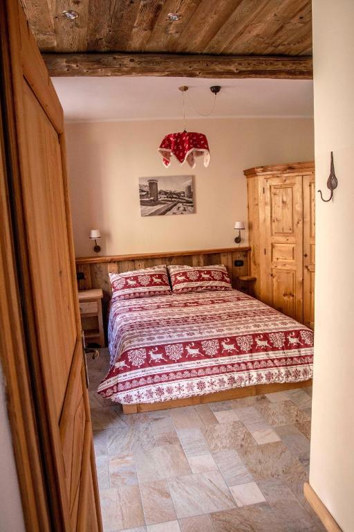 Postel nebo postele na pokoji v ubytování Le Petit Fenestrelle