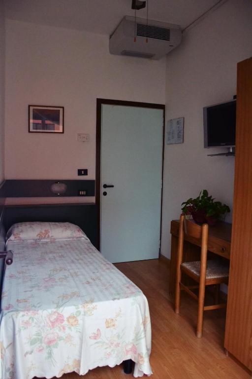 Postel nebo postele na pokoji v ubytování Hotel Rex