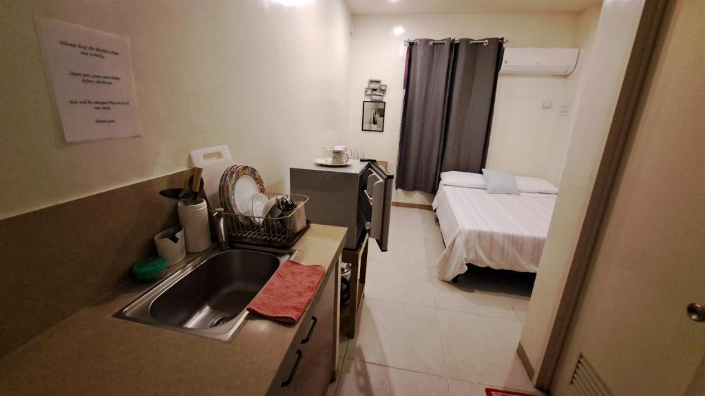 Postel nebo postele na pokoji v ubytování Villa Pamana Inn Puerto Galera powered by Cocotel
