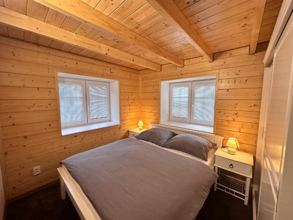Postel nebo postele na pokoji v ubytování Apartmány Hanička