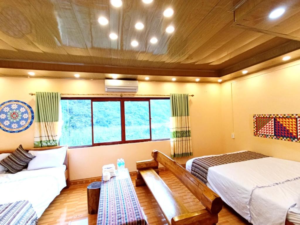 Postel nebo postele na pokoji v ubytování A Kiệt Homestay