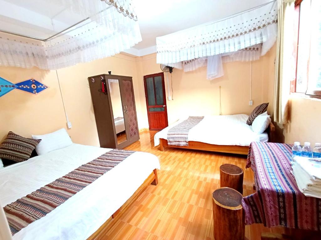 Postel nebo postele na pokoji v ubytování A Kiệt Homestay