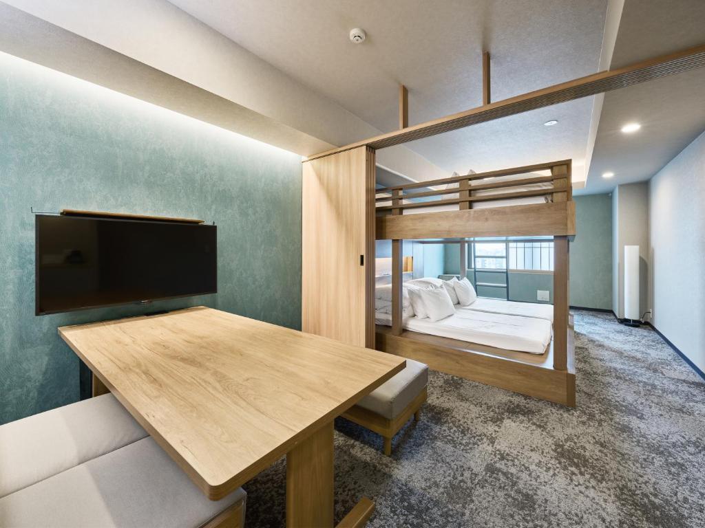 Postel nebo postele na pokoji v ubytování MIMARU Tokyo Ikebukuro