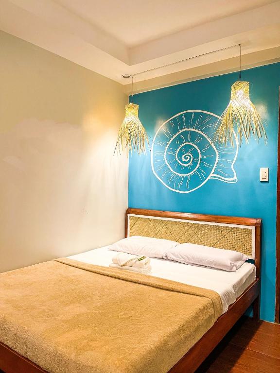 Postel nebo postele na pokoji v ubytování Amos Portside Inn El Nido