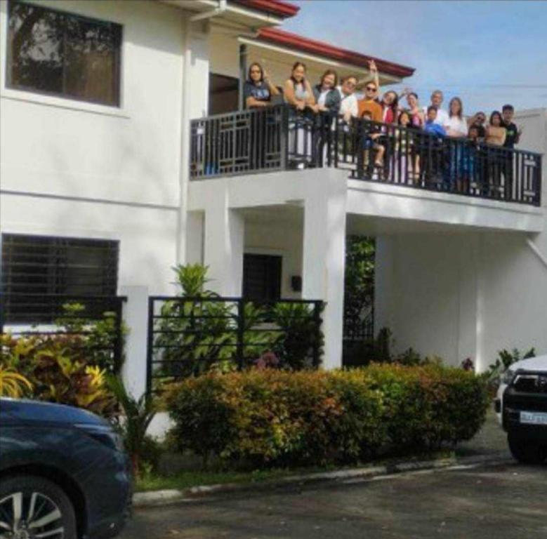 a group of people on the balcony of a building at casa lilia in Tagaytay