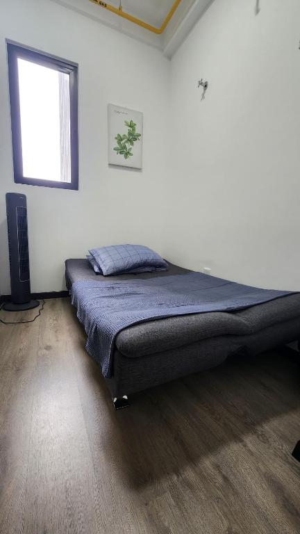 Postel nebo postele na pokoji v ubytování CasaZlyn Studio By MySky Stays at Presint 5, Putrajaya