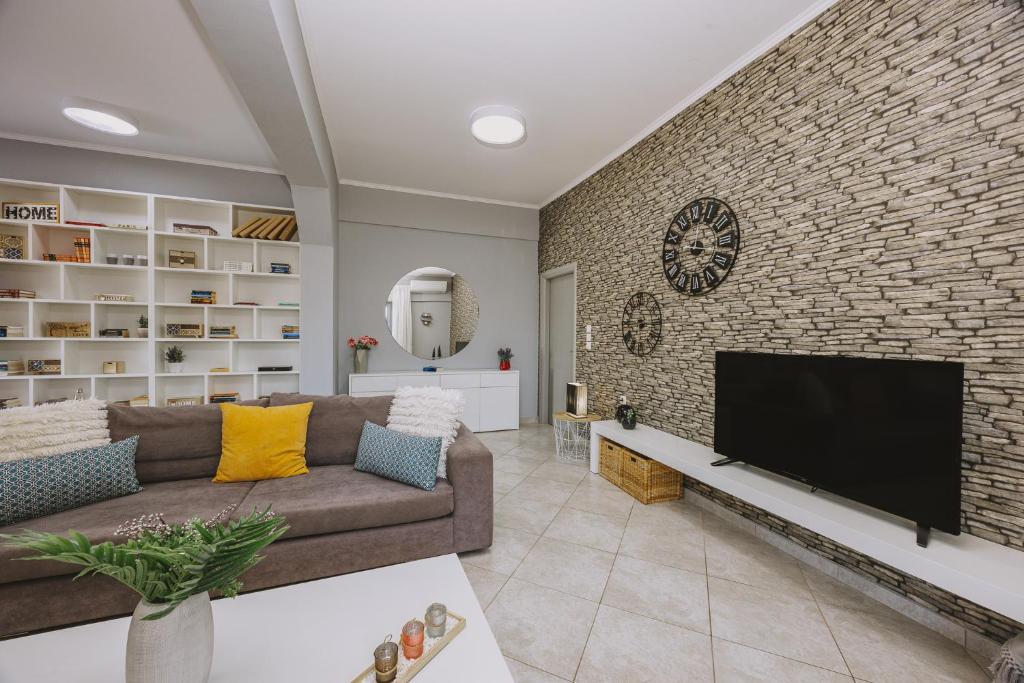 Televízia a/alebo spoločenská miestnosť v ubytovaní Villa Bella Gonia