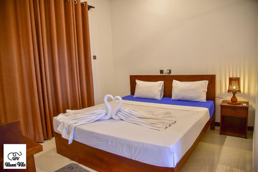 Postel nebo postele na pokoji v ubytování Wanni Villa Resort & Safari