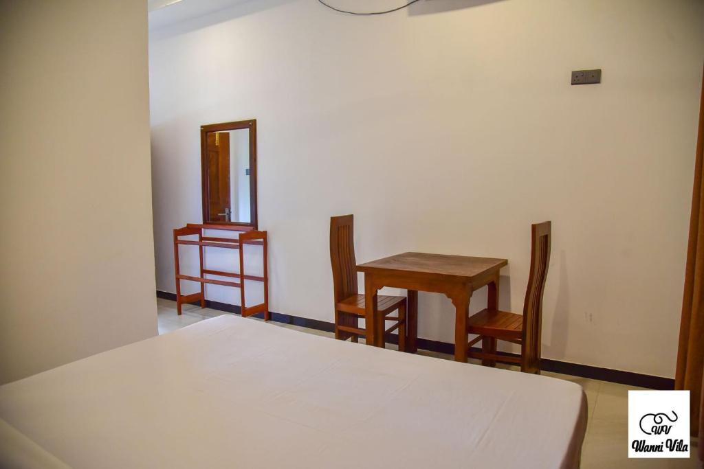 Postel nebo postele na pokoji v ubytování Wanni Villa Resort & Safari