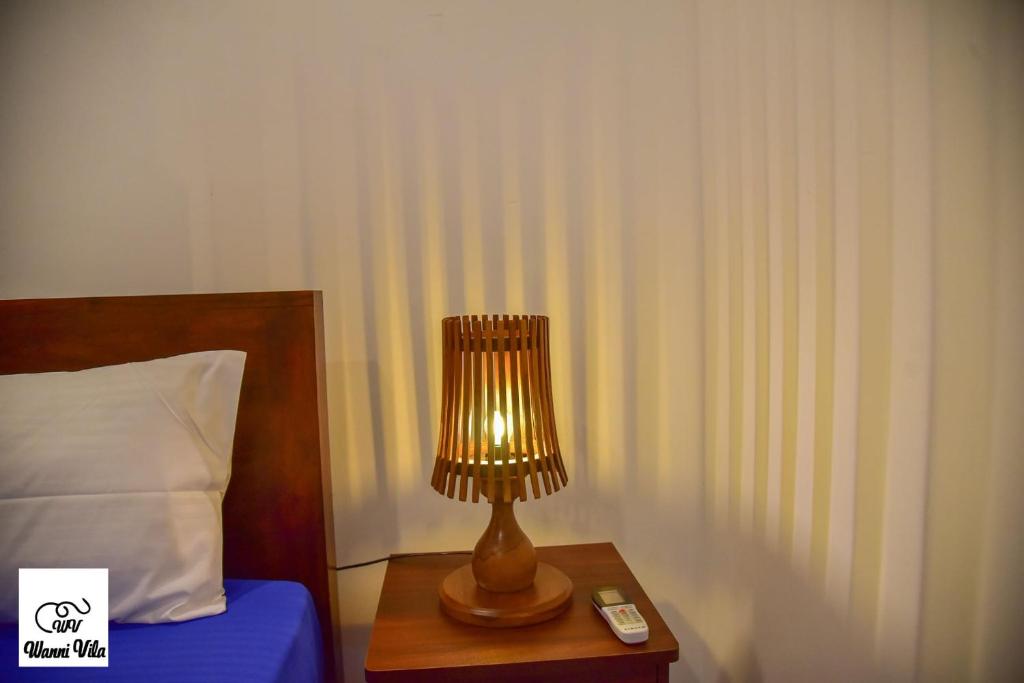 Postel nebo postele na pokoji v ubytování Wanni Villa Resort & Safari
