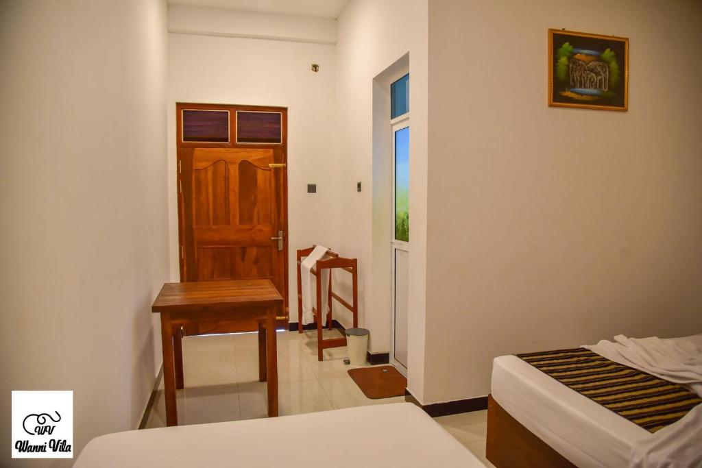 Postel nebo postele na pokoji v ubytování Wanni Villa Resort & Safari