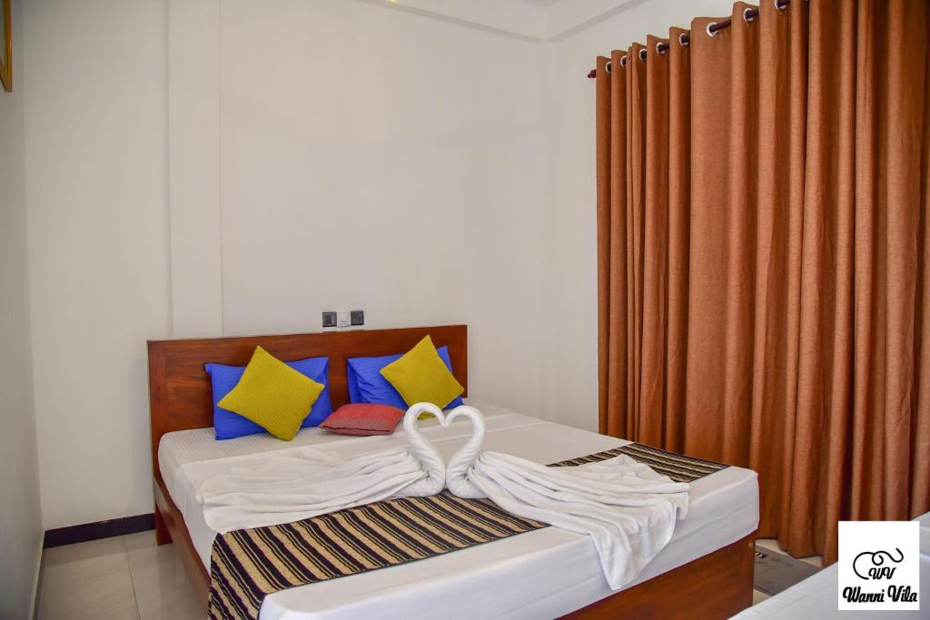 Postel nebo postele na pokoji v ubytování Wanni Villa Resort & Safari