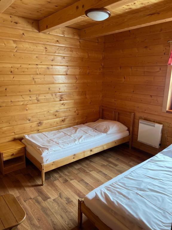 Postel nebo postele na pokoji v ubytování Chaty Lipa