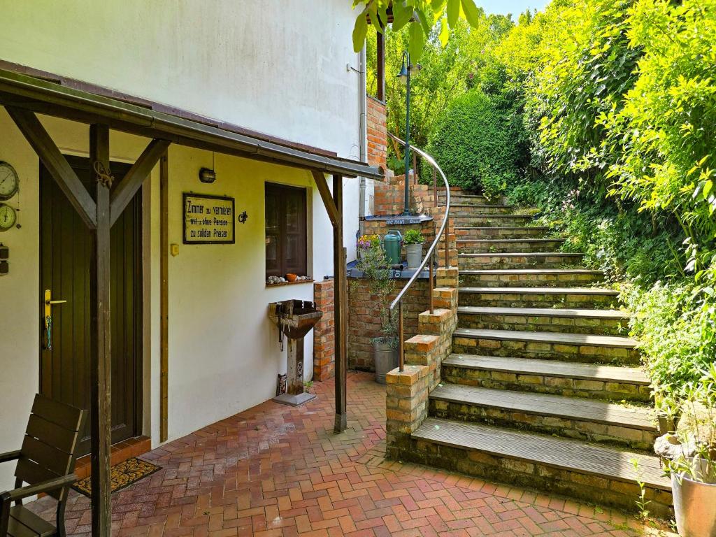 a set of stairs next to a building at Rügen - Promoisel - Auszeit am Kreidesee in Sagard
