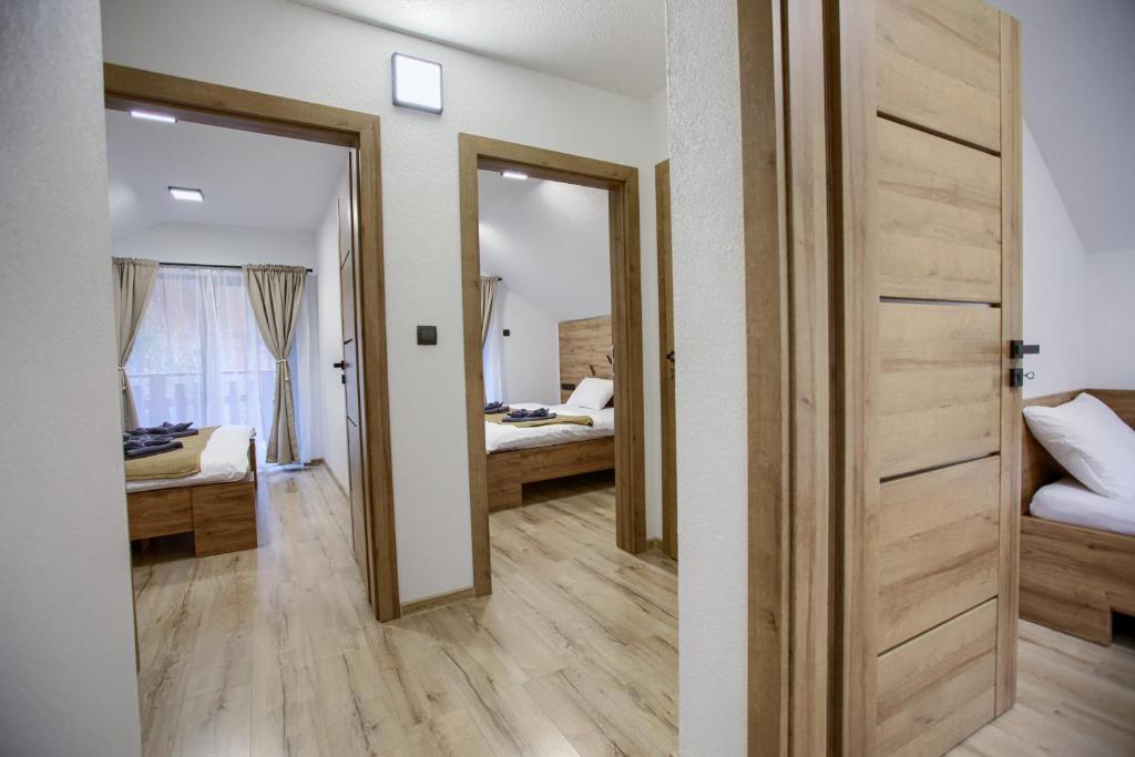 Postel nebo postele na pokoji v ubytování Resort Biela Skala - CHALETKA Chopok Jasná Juh