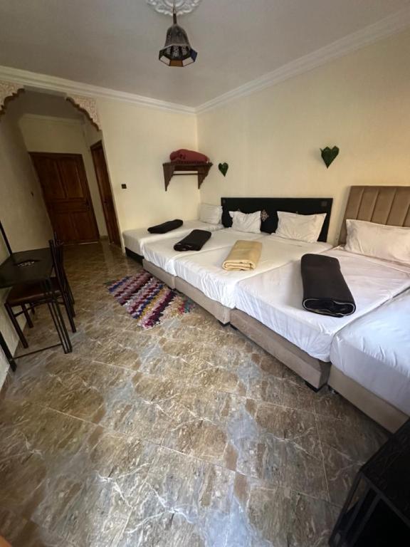 Postel nebo postele na pokoji v ubytování Kasbah Imoula