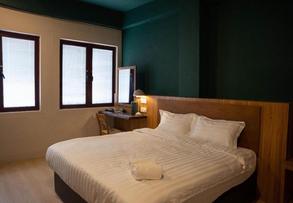 Postel nebo postele na pokoji v ubytování Room V Jalan Sultanah By SECOM