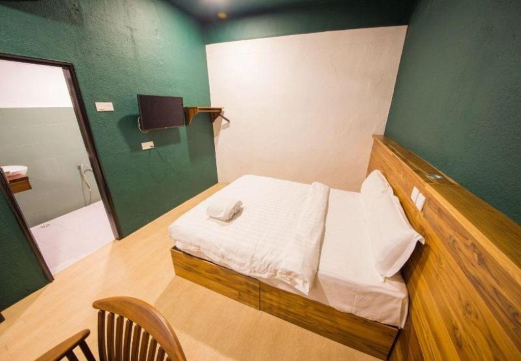 Postel nebo postele na pokoji v ubytování Room V Jalan Sultanah By SECOM