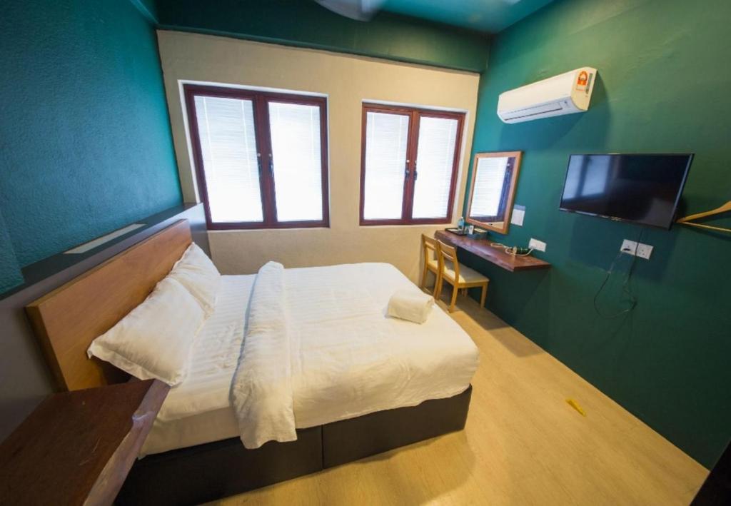 Postel nebo postele na pokoji v ubytování Room V Jalan Sultanah By SECOM