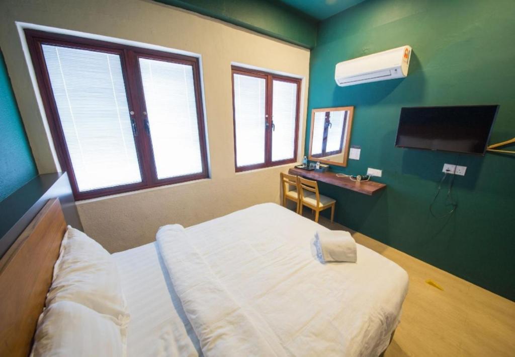 Postel nebo postele na pokoji v ubytování Room V Jalan Sultanah By SECOM