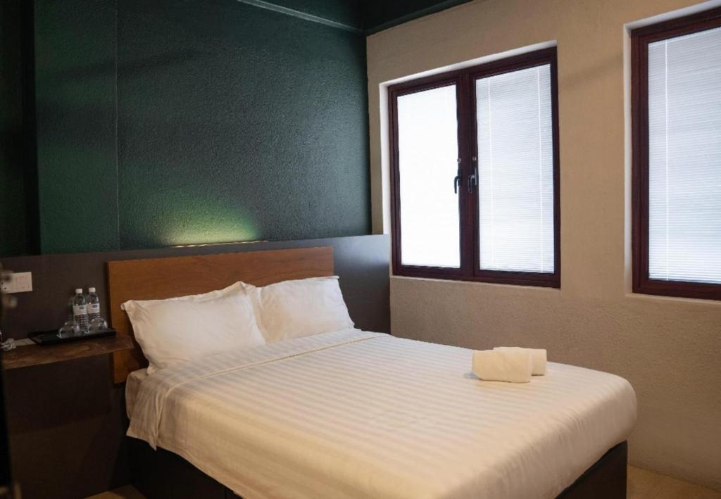 Postel nebo postele na pokoji v ubytování Room V Jalan Sultanah By SECOM
