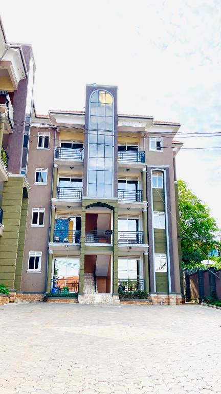 a large apartment building with a lot of windows at Lake View Muyenga Apartment in Kampala