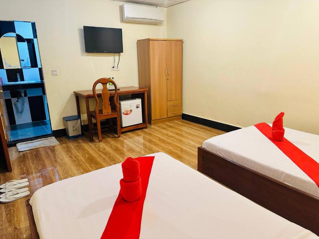 Postel nebo postele na pokoji v ubytování Capitol One
