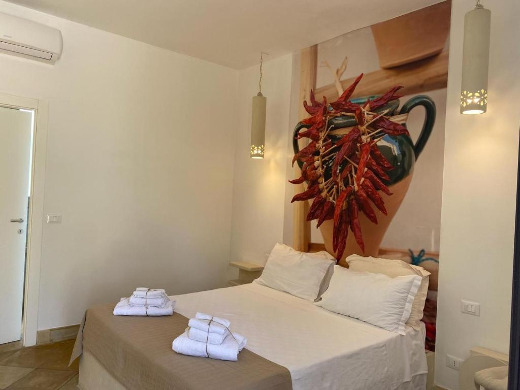 A bed or beds in a room at Tenuta Sidore