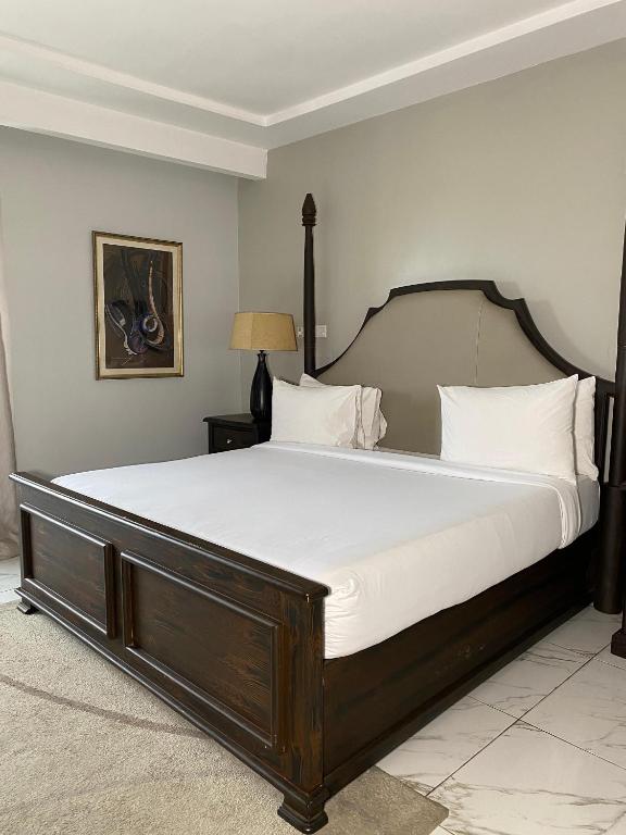 Voodi või voodid majutusasutuse Genesis Reventon Hotel toas