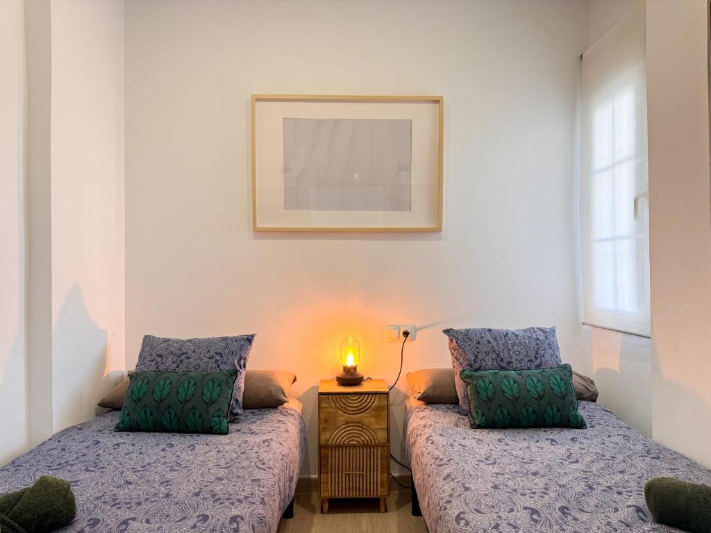 Postel nebo postele na pokoji v ubytování Tarifa Cozy House - Beach Front, Pool, Parking