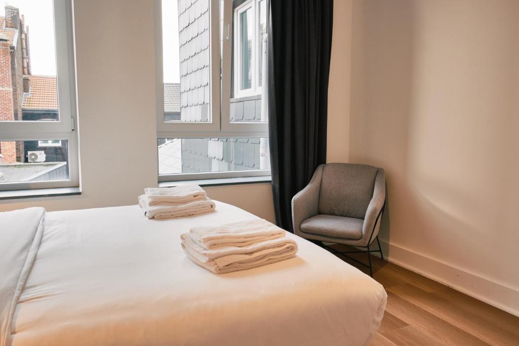 Una cama o camas en una habitación de Urbanchic atmosphère 2D