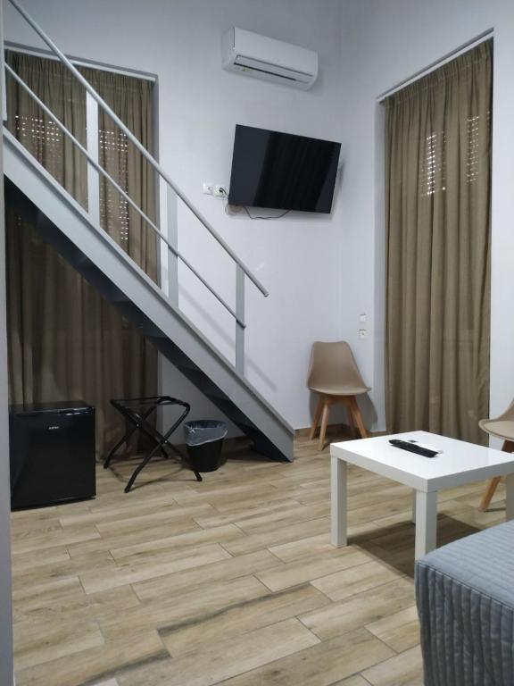 TV a/nebo společenská místnost v ubytování Kentrikon