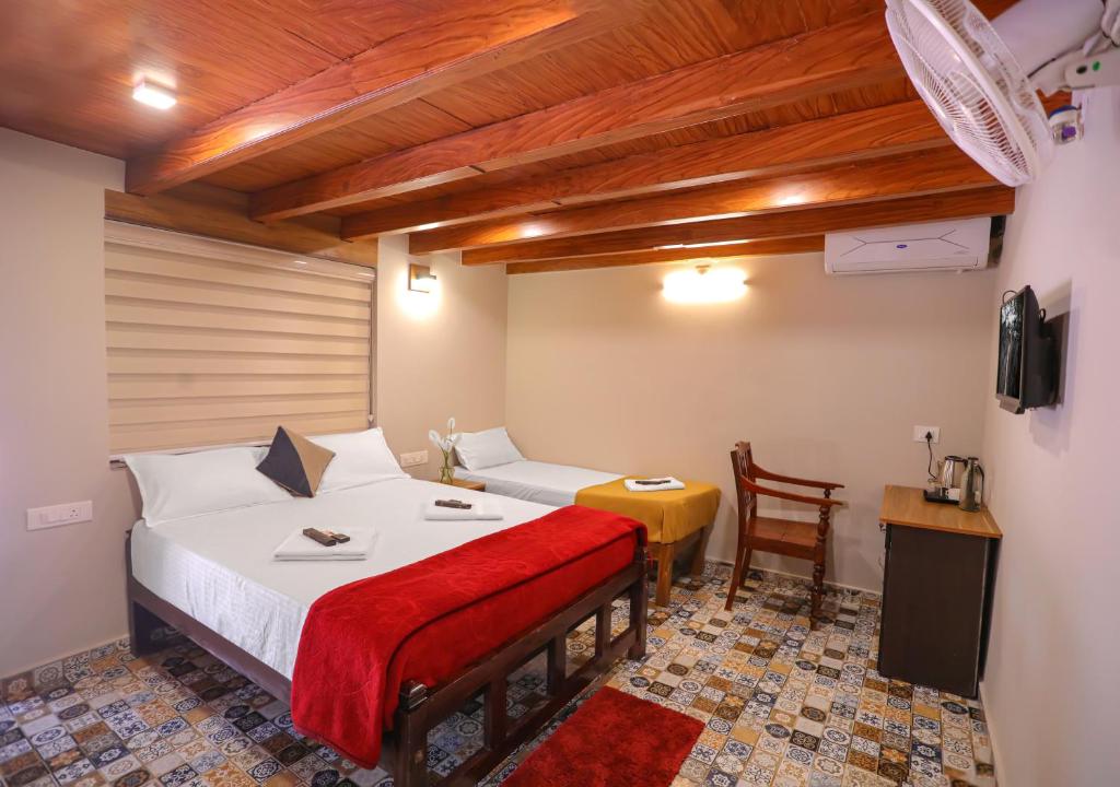 Postel nebo postele na pokoji v ubytování Kudajadri Drizzle Homestay