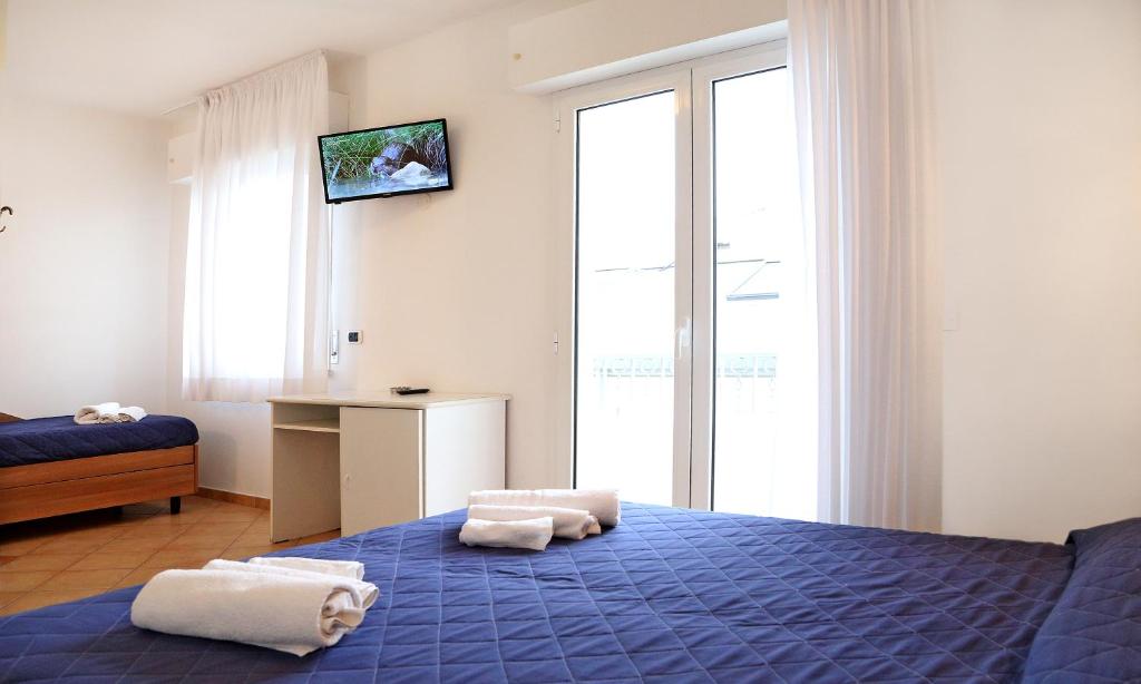 Postel nebo postele na pokoji v ubytování Hotel Edera - in pieno Centro a pochi passi dal Mare