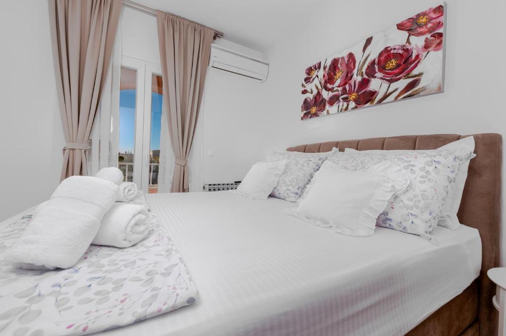 Postel nebo postele na pokoji v ubytování Villa Rossa
