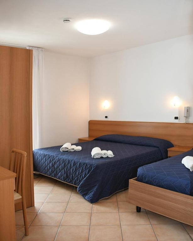 Postel nebo postele na pokoji v ubytování Hotel Edera - in pieno Centro a pochi passi dal Mare