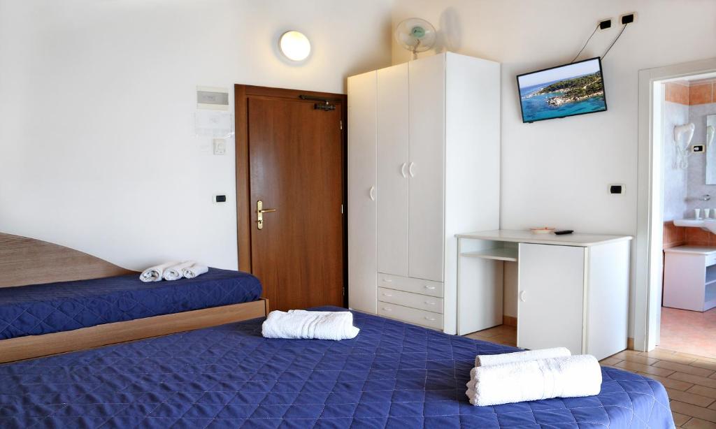 Postel nebo postele na pokoji v ubytování Hotel Edera - in pieno Centro a pochi passi dal Mare