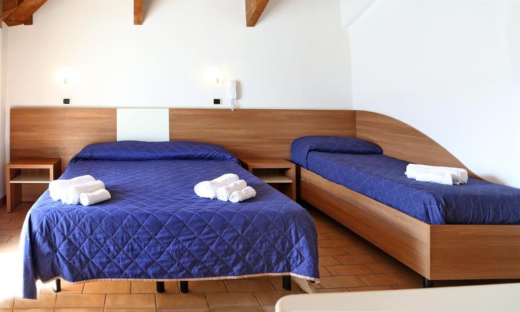 Postel nebo postele na pokoji v ubytování Hotel Edera - in pieno Centro a pochi passi dal Mare