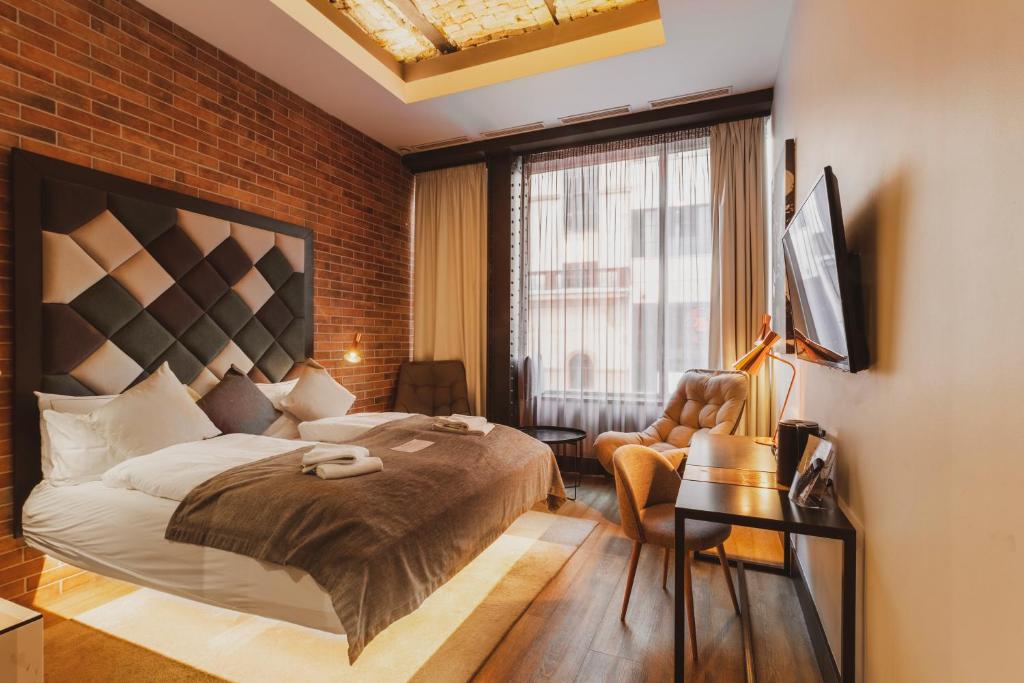 Postel nebo postele na pokoji v ubytování The Loft Budapest